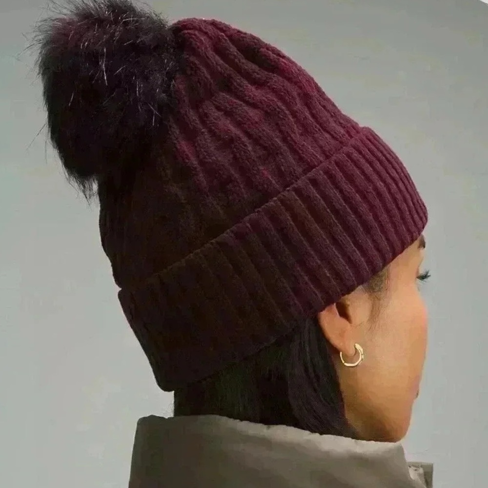 Lululemon Cable Knit Pom Beanie in the color burgundy (CSSI) Cassis NWOT